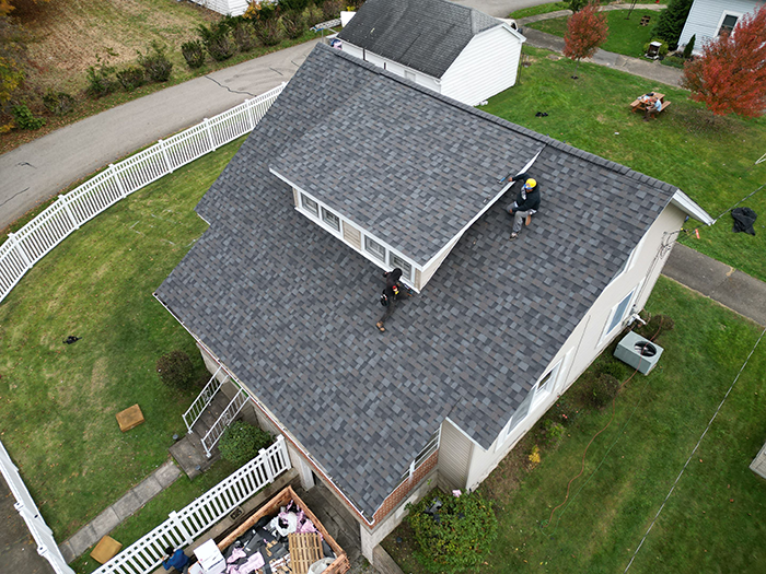 Photo: AR Remodeling crew finishing up a roof replacement job.